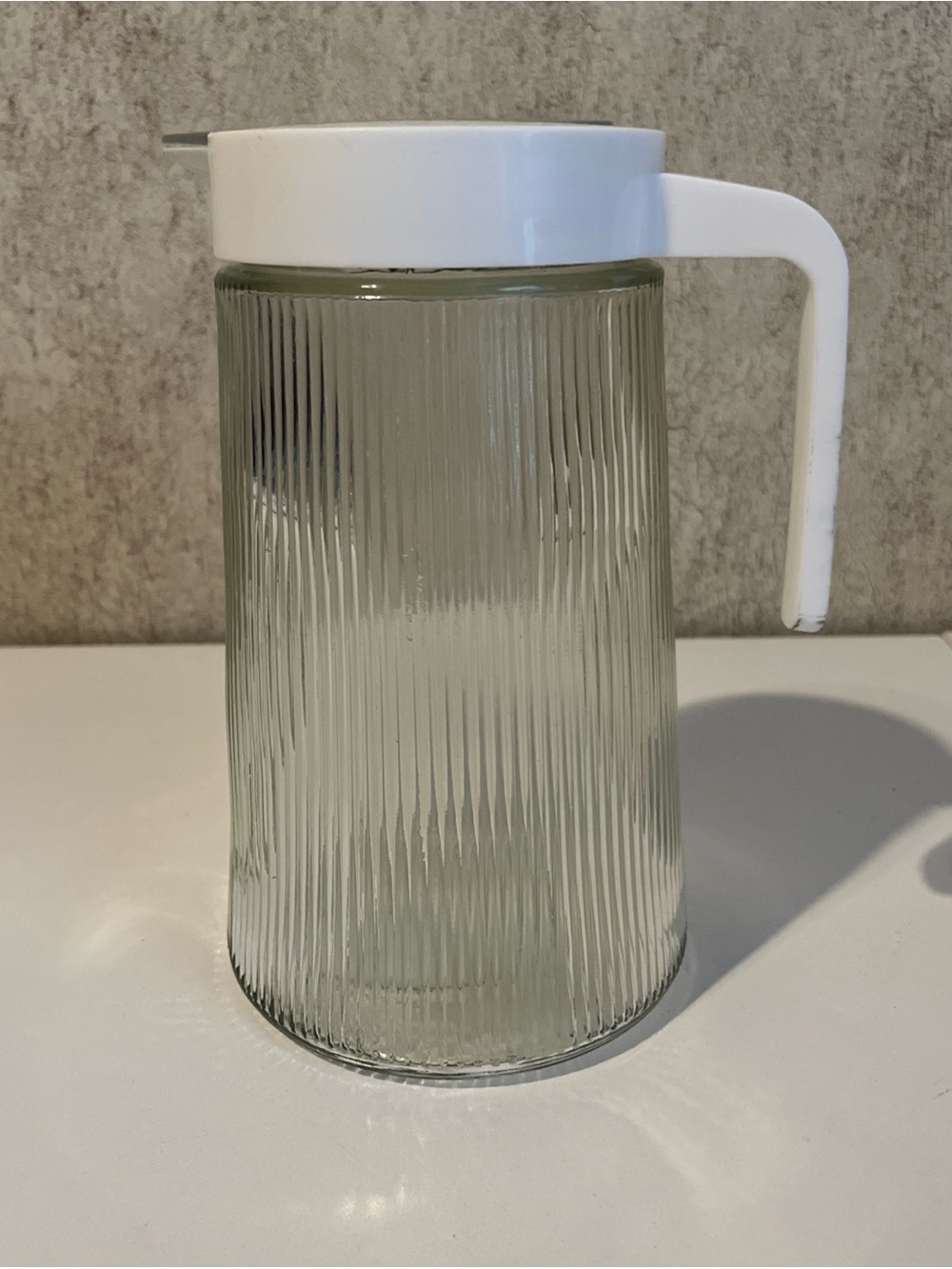 Ribbed Clear Glass Pitcher with White Plastic Lid and Handle 40oz